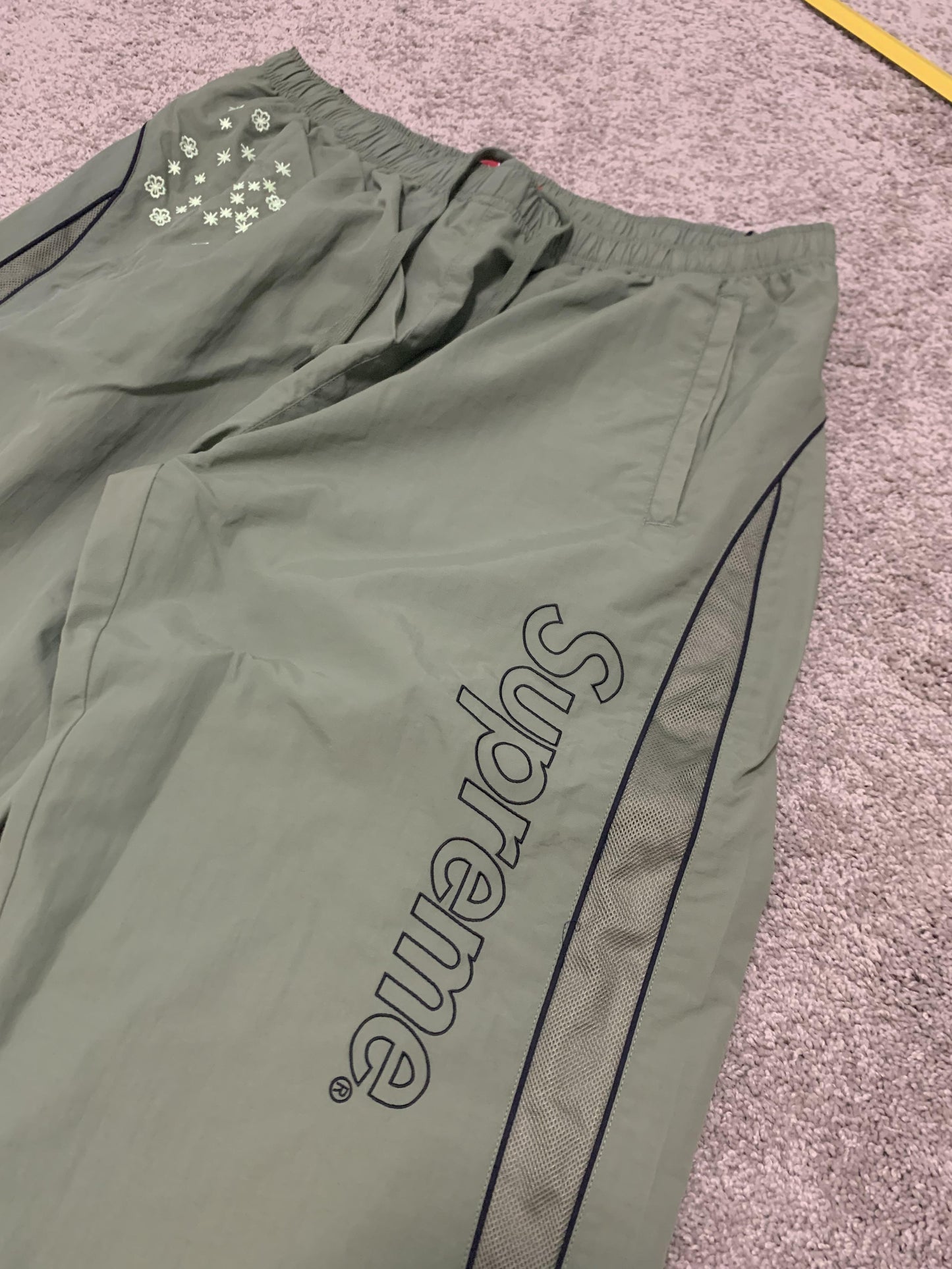 Supreme AOI Glow Track Pants