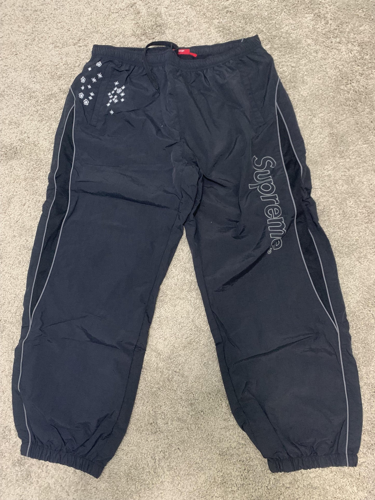 Supreme AOI Glow Track Pants